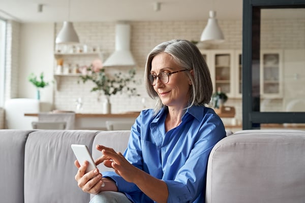 woman phone sofa