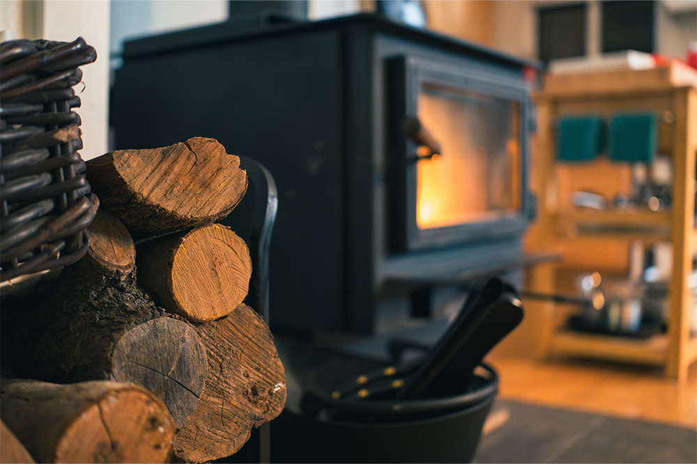 Wood-burning stove and auxiliary heating