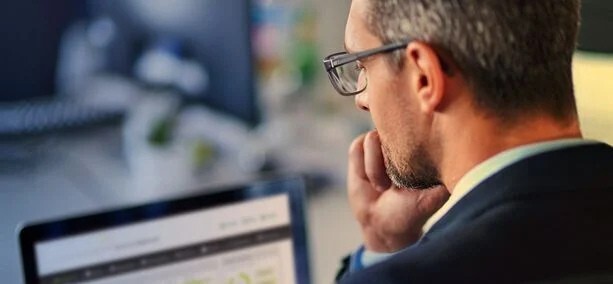 MBlive man looking at screen no logo